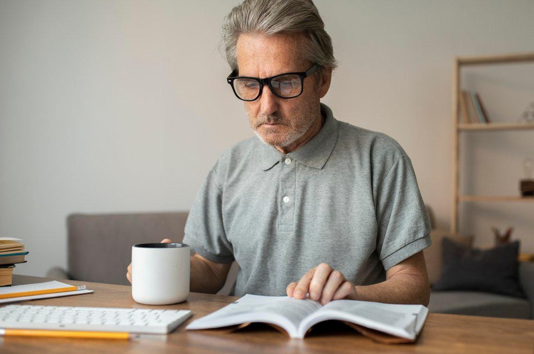 senior-man-reading-his-lesson-school