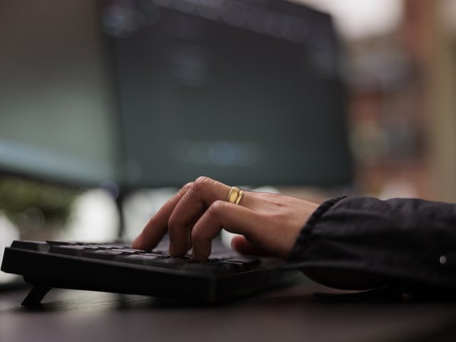 cyber-security-agency-network-developer-doing-ethical-hacking-retrieve-encrypted-stolen-data-system-developer-writing-lines-codes-order-build-anomaly-analyser-database-close-up